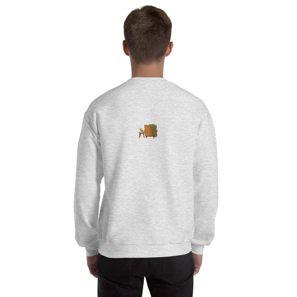 Model wearing Cozy Reading Chair unisex sweatshirt in Ash, back view with small armchair illustration