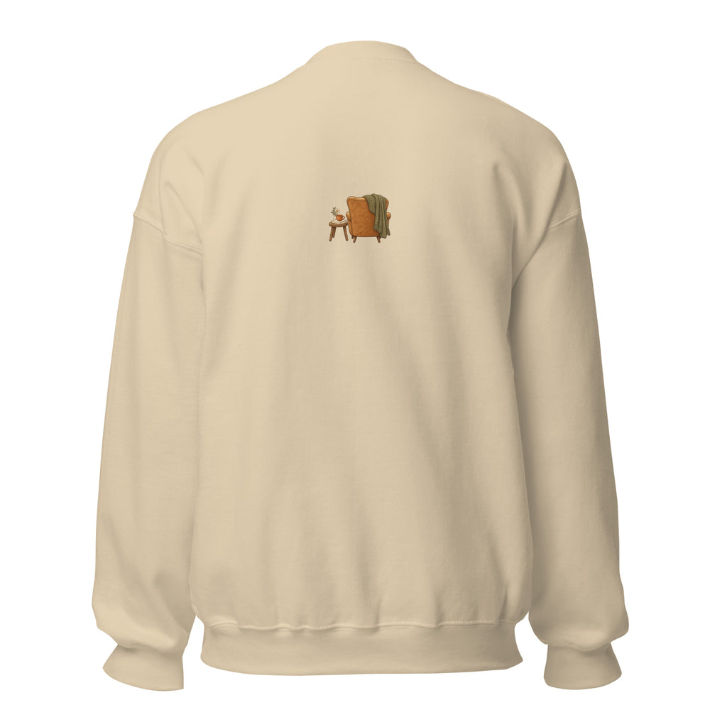 Product mockup of Cozy Reading Chair unisex sweatshirt in Sand, back view with small armchair illustration