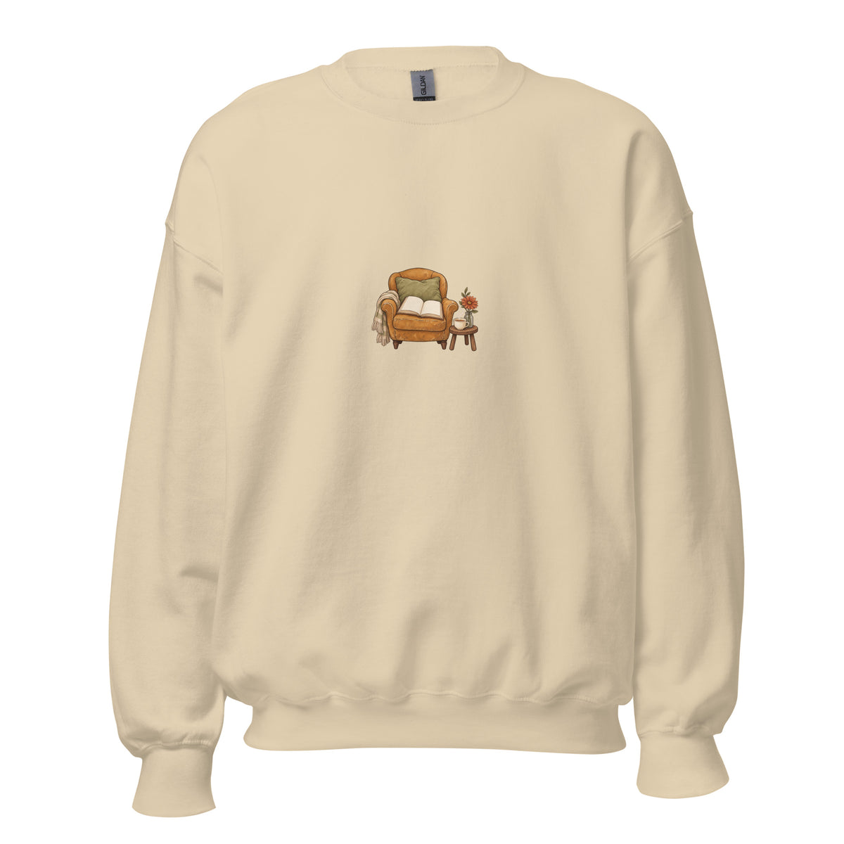 Product mockup of Cozy Reading Chair unisex sweatshirt in Sand, front view with armchair, open book and side table