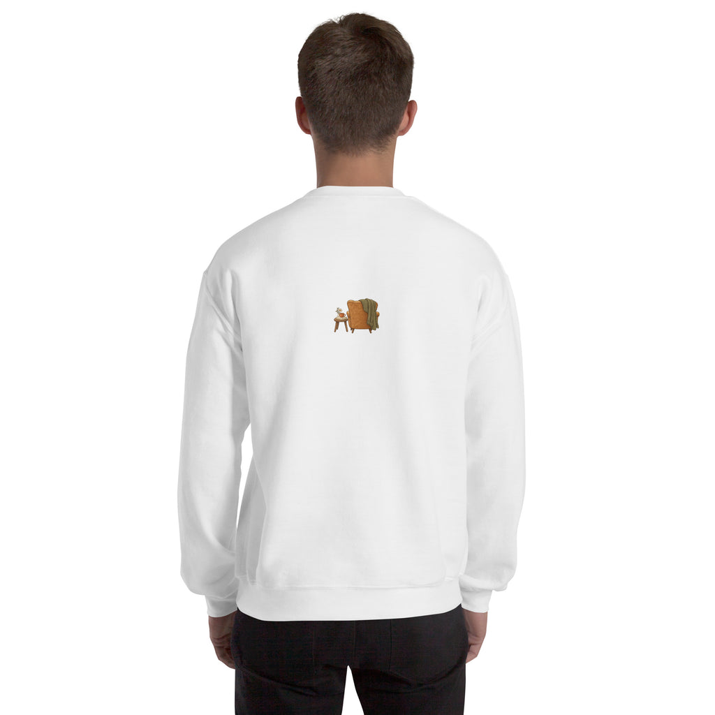 Model wearing Cozy Reading Chair unisex sweatshirt in White, back view with small armchair illustration