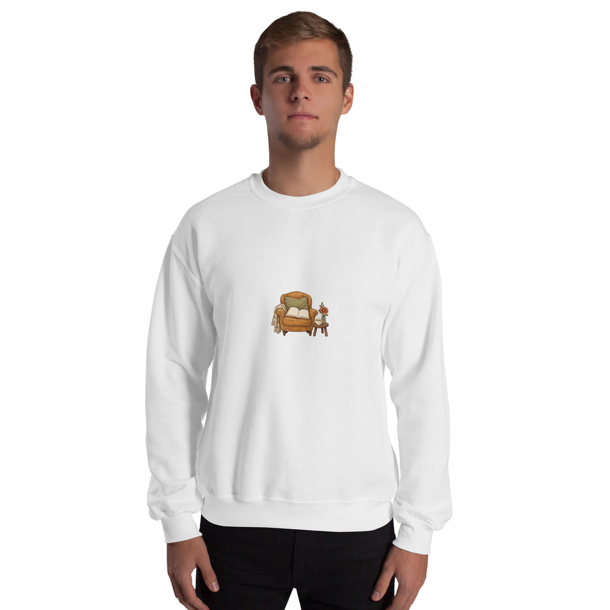 Model wearing Cozy Reading Chair unisex sweatshirt in White, front view with armchair, open book and side table