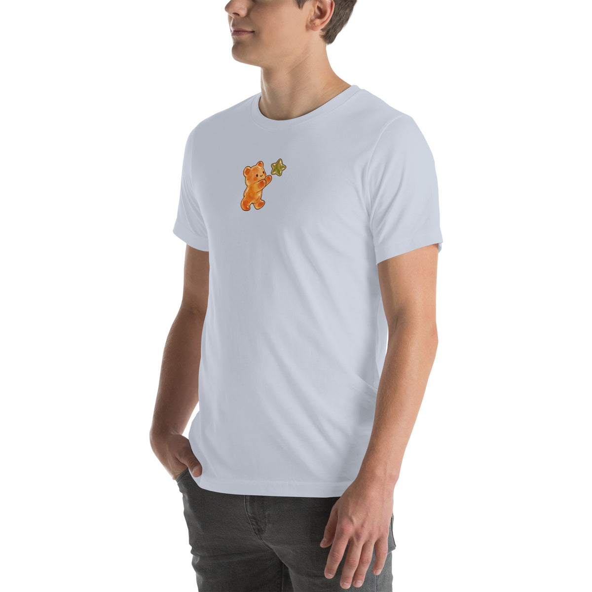 Model wearing Gummy Bear & Star unisex T-shirt in Light Blue, front view with amber bear reaching for olive star
